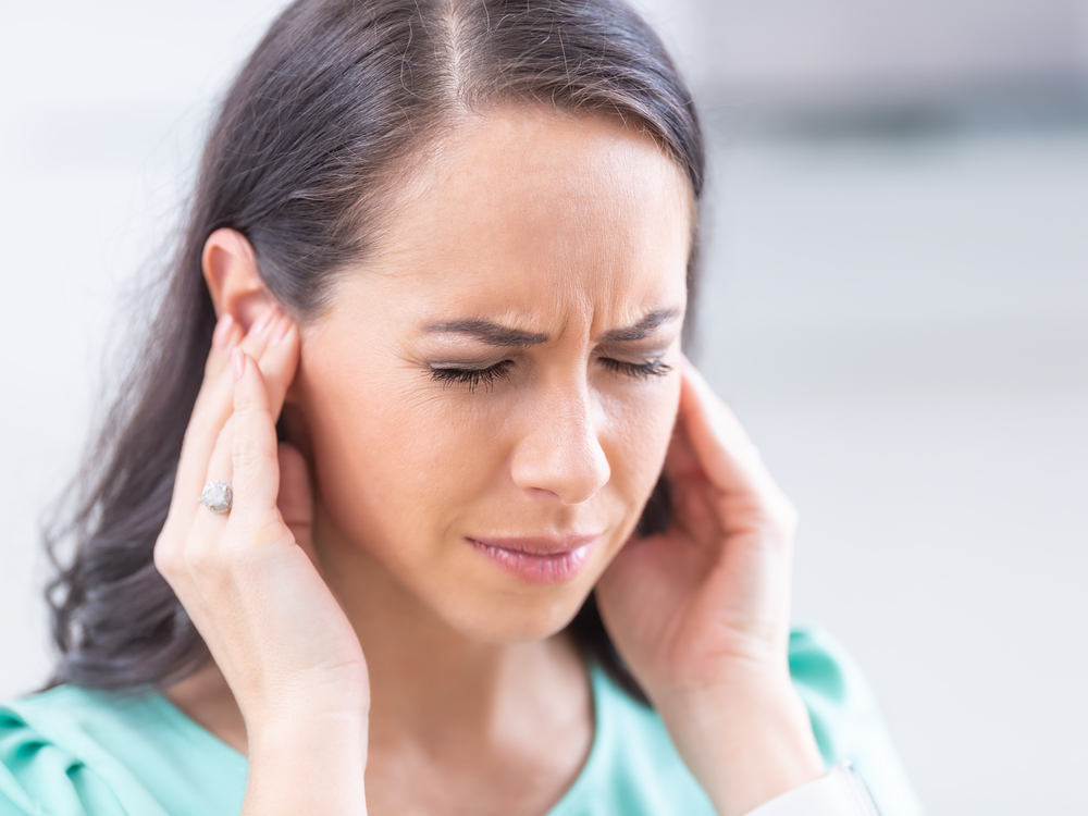 Dr. Britney Ometz, Au.D. evaluating a patient for tinnitus and ringing in the ears at Anne Arundel Audiology in Glen Burnie, MD